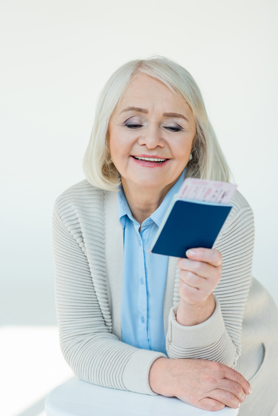 senior woman with passports and tickets - Φωτογραφία, εικόνα