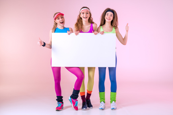 sporty women holding banner - Photo, Image