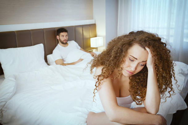 Sad couple on bed after fight  - Valokuva, kuva