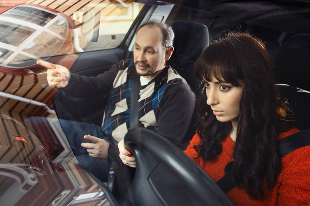Father teaching daughter how to drive a car - Photo, Image