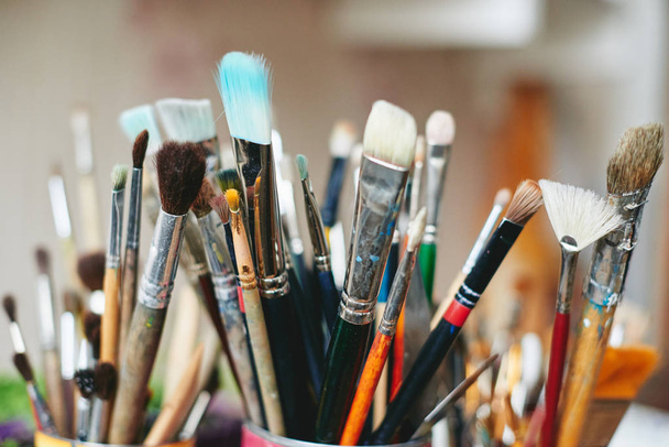 Painting brushes in artist workshop - Foto, afbeelding