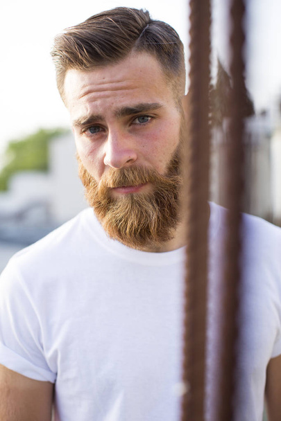 Bearded man posing in the street. - Photo, image