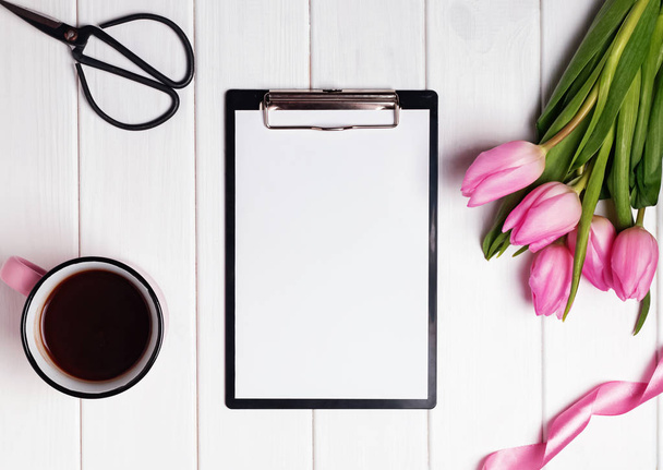Mock up with blank paper, pink tulips and coffee on the white wo - Fotografie, Obrázek