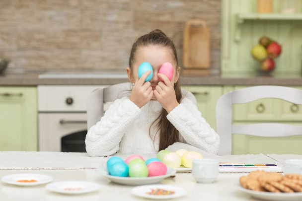 Funny little girl with two Easter eggs - Photo, Image