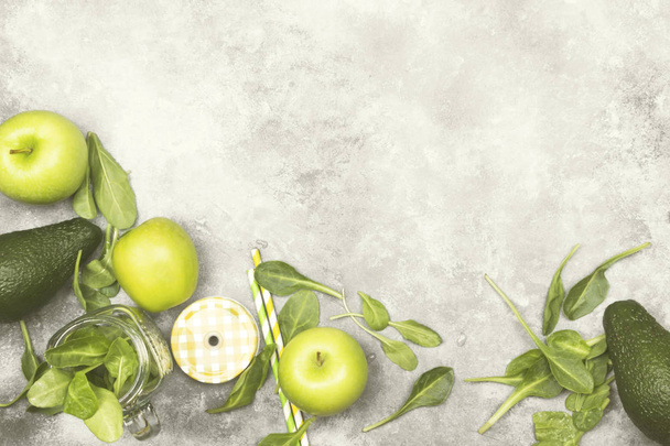 Ingredients for green smoothie - apples, spinach, celery, avocado on a light background. Top view, copy space. Food background. Toning - Фото, изображение
