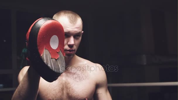 Two young professional boxers are fighting on the boxing ring. Slow motion. - Materiał filmowy, wideo