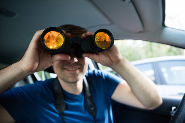 Male Looking Through Binoculars - 写真・画像