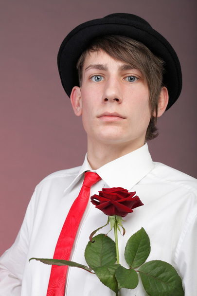 Portrait young man and rose enamoured love - Foto, imagen