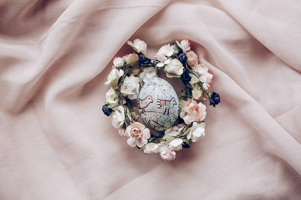 easter egg in floral nest - Photo, image