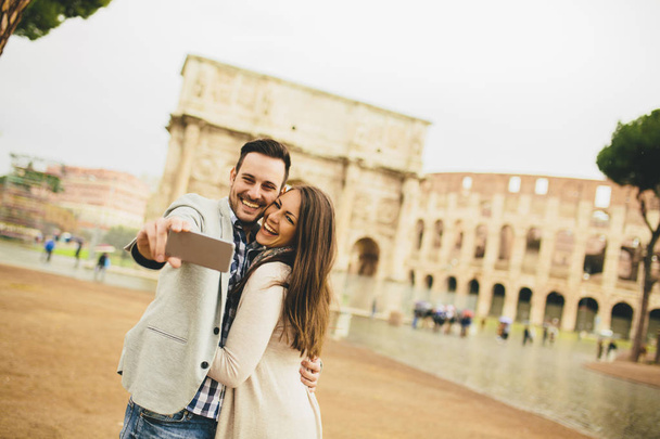 Couple in front of the Colosseum - Photo, Image
