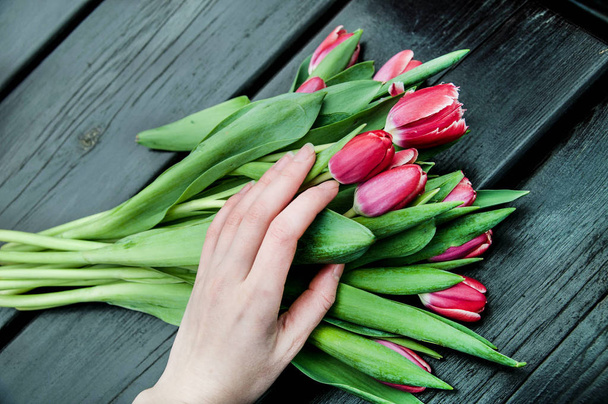 bouquet of tulips at wooden background - Zdjęcie, obraz