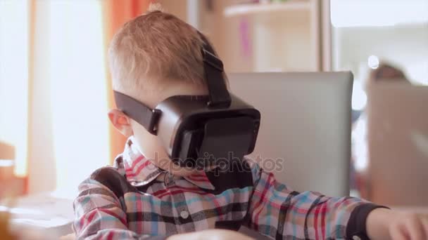 Little boy use virtual reality headset helmet, he very impressed - Footage, Video