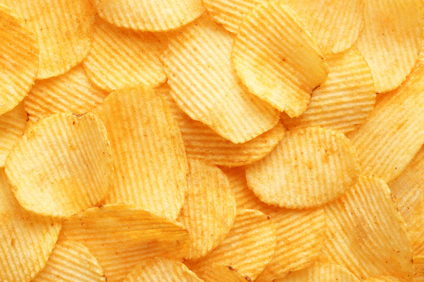 achtergrond golvende gouden chips met textuur - Foto, afbeelding