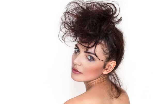 Pretty woman portrait with messy hair and smudged makeup looking back - Foto, Imagen