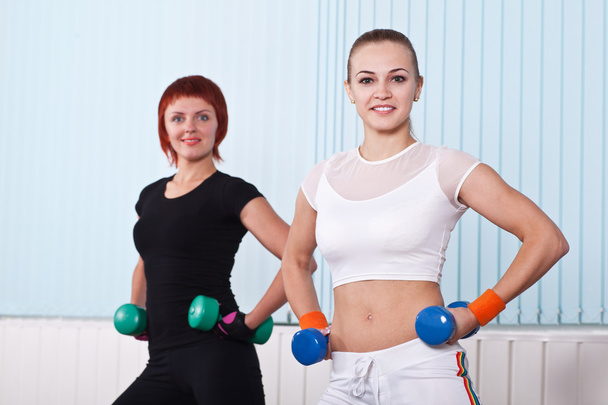 two fitness women with hand weights - Photo, image