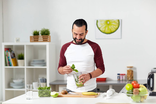 man with blender cup cooking food at home kitchen - Fotografie, Obrázek
