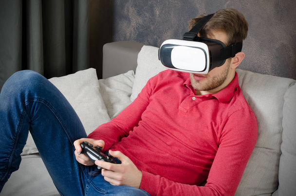 Man wears virtual reality glasses with smartphone inside - Foto, Imagen