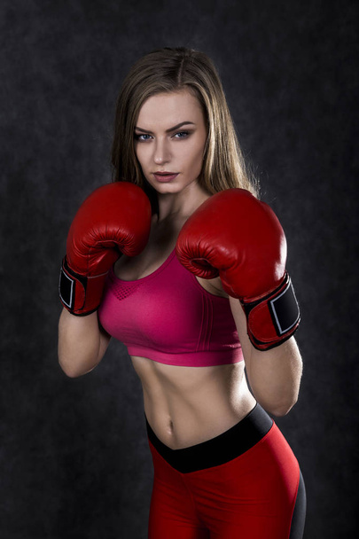 Confident boxing woman in red box gloves - Фото, зображення