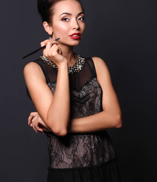 Portrait of young beautiful woman with jewelry - Foto, imagen