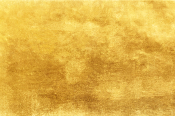 Gouden achtergrond of textuur en hellingen schaduw. - Foto, afbeelding