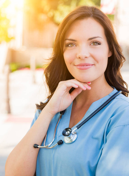 Young Adult Woman Doctor or Nurse Holding Touch Pad Outside. - Photo, Image
