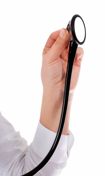 Doctor's hands holding stethoscope.Studio shot isolated on white - Photo, Image
