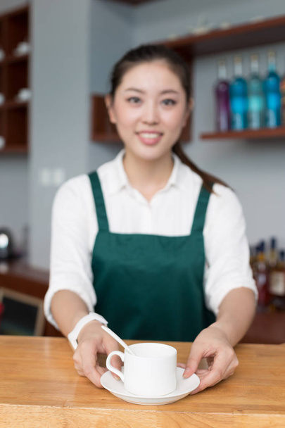 young pretty woman works in cafe - Photo, Image