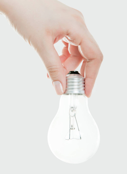 lamppu (lamppu) kädessä Eristetty valkoisella taustalla
 - Valokuva, kuva