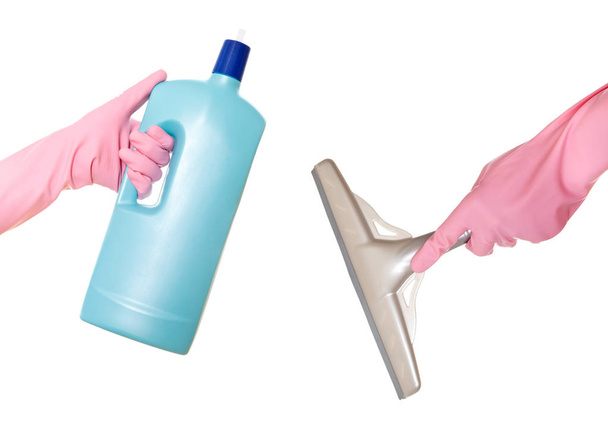 Hand in gloves with rubber window cleaner. Isolated on a white b - Photo, Image