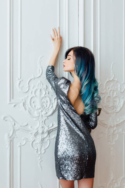 Fashion portrait of gorgeous girl with blue dyed hair long. The beautiful evening cocktail dress. - Φωτογραφία, εικόνα