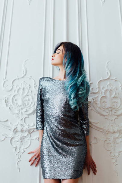 Fashion portrait of gorgeous girl with blue dyed hair long. The beautiful evening cocktail dress. - Фото, изображение