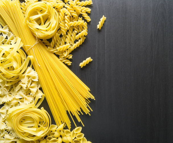 A variety of types and forms of dry Italian pasta. the view from - Photo, Image