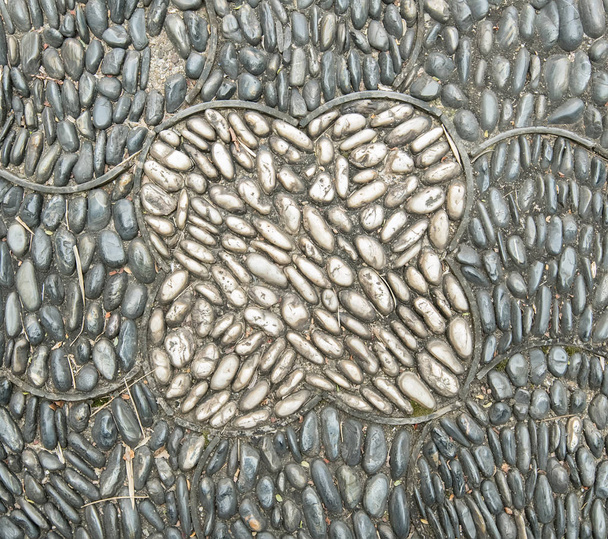 background made of a closeup of a wall with pebbles - Photo, Image