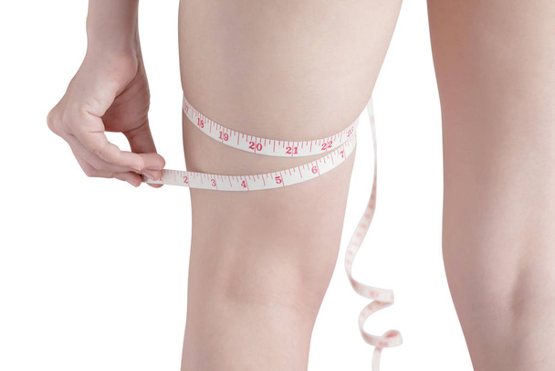 Woman measuring obese isolated on white background. Clipping path on white background. - Photo, Image