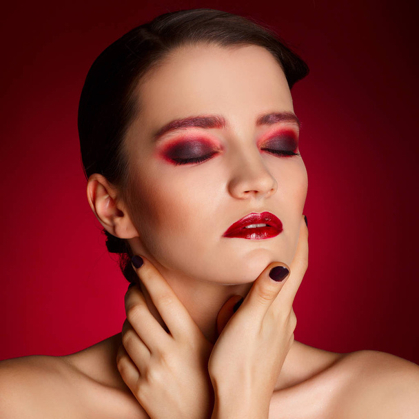 Portrait of beautiful sexy fashion model with red make up over r - Fotó, kép