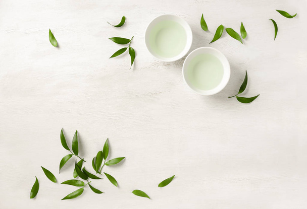 Two white cups of tea, view from above background - Photo, Image