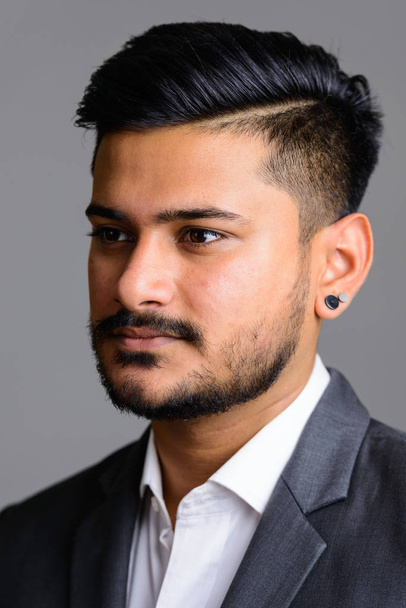 Face of young handsome Indian businessman  - Photo, image