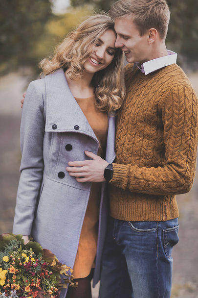 Portrait of beautiful young couple smiling hugs, love each other - Photo, Image