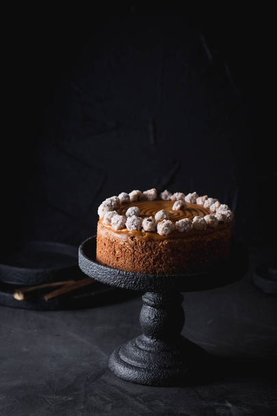 A birthday cake with salted caramel and hazelnuts. - Фото, изображение