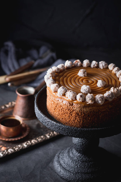 A birthday cake with salted caramel and hazelnuts. - Фото, изображение