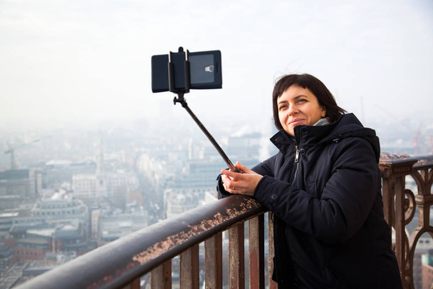 woman taking a selfie from the rooftop of St Paul's Cathedral on - Photo, Image