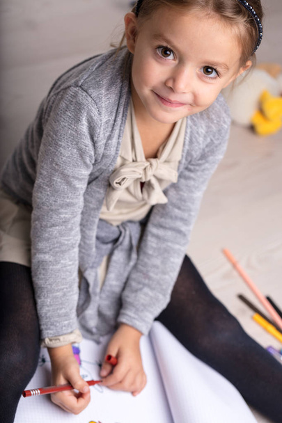 Adorable artistic little girl doing drawing - Фото, зображення