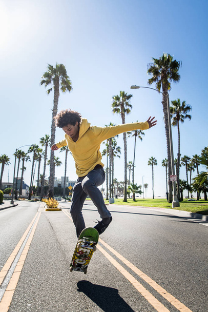 Skateboarder in action outdoors - Φωτογραφία, εικόνα