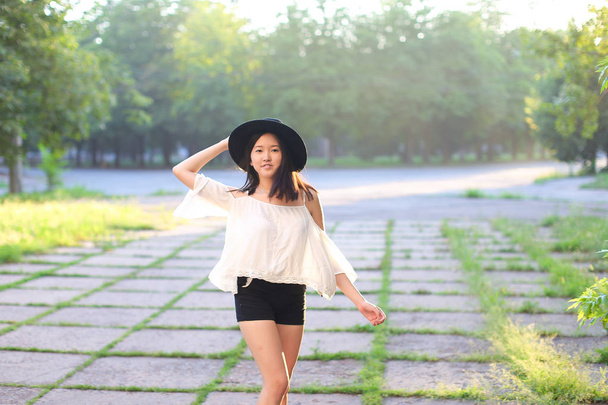 wonderful female hat asian sunset cheerful emotions laughter - Photo, Image