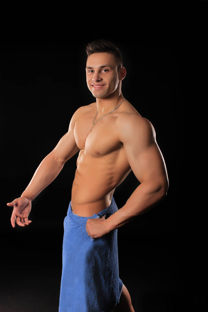 handsome bodybuilder man in shorts showing muscles - 写真・画像