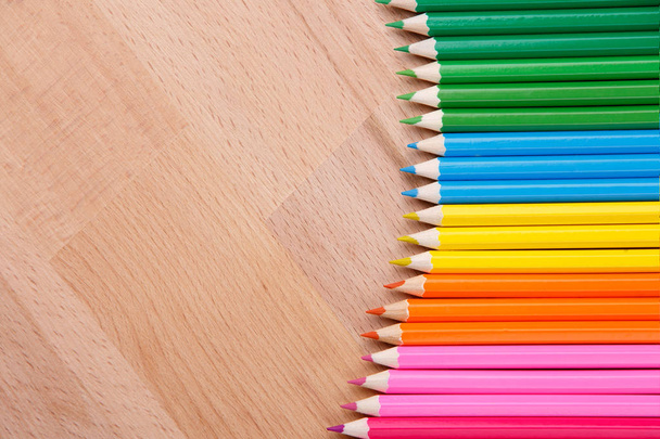colored pencils colored pencils on the wooden table clous-up - Фото, зображення