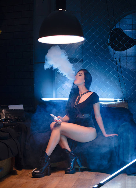Sexy brunette vaping vaponizer and clouding, woman with sexy bod - Φωτογραφία, εικόνα