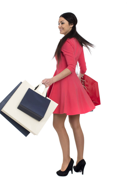 Young brunette woman with some shopping bags  - Foto, immagini