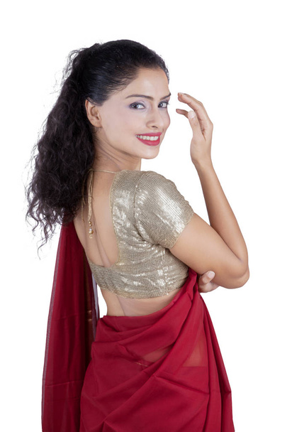 Indian woman wearing sari clothes on studio - Fotó, kép