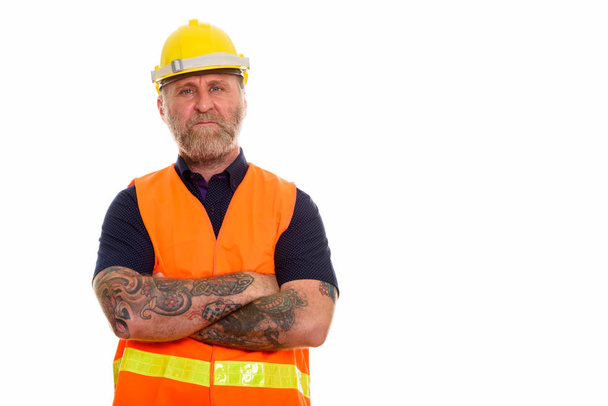 Mature bearded man construction worker with hand tattoos with ar - Fotoğraf, Görsel